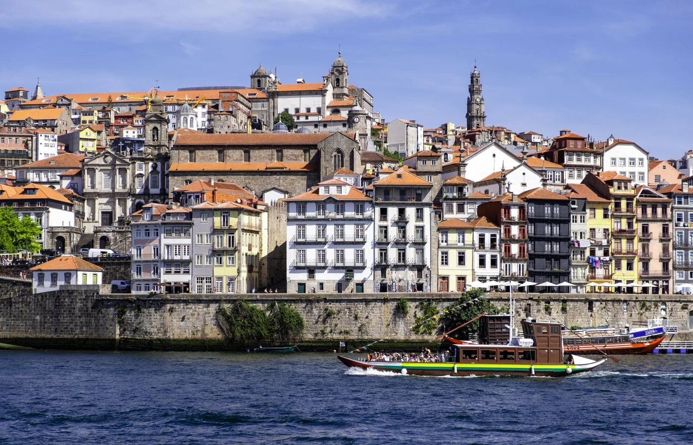 Colorful buildings and riverboats beside the Douro in Porto’s Ribeira district.