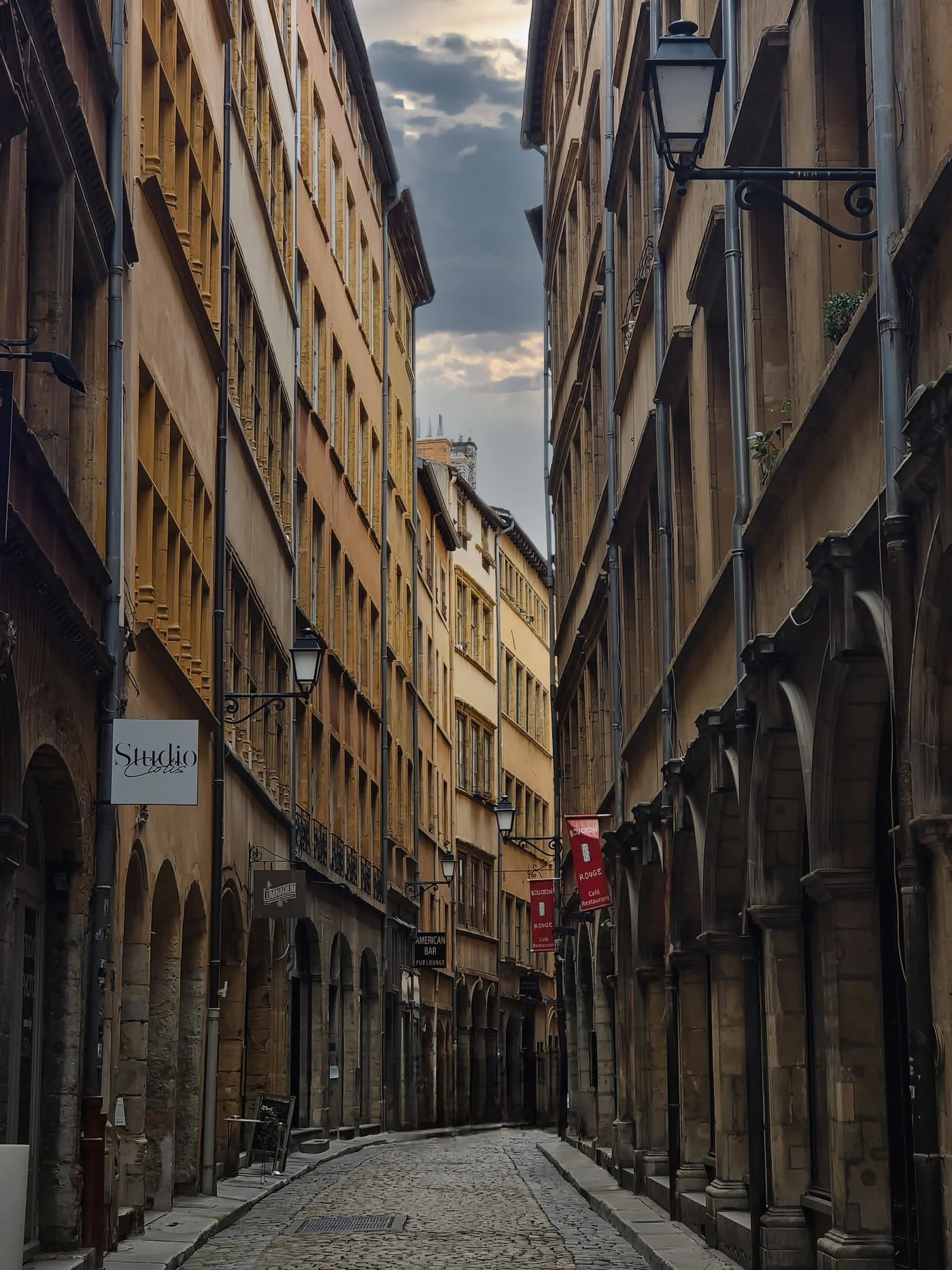 A narrow street between historic buildings in Vieux Lyon.