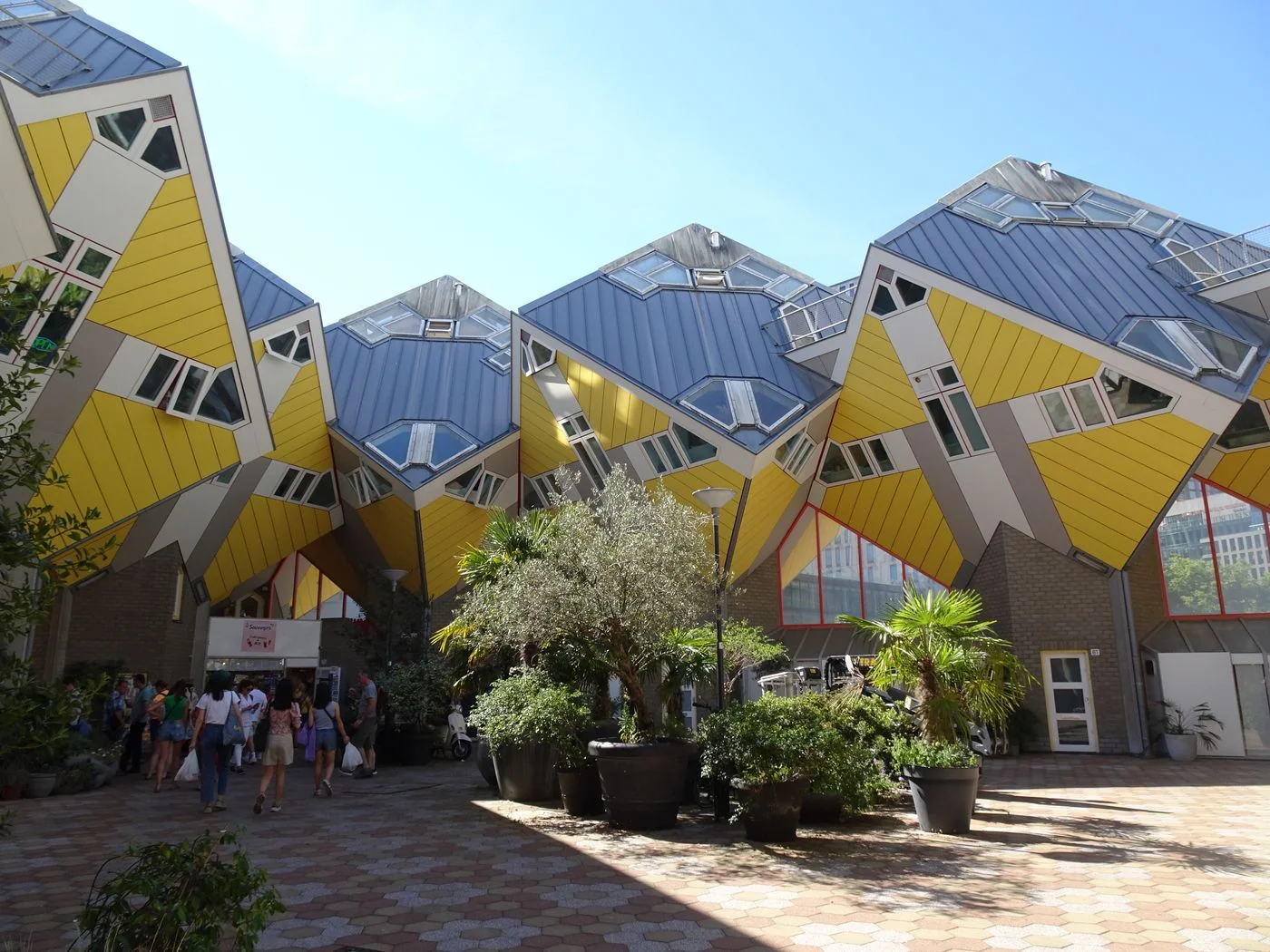 The yellow Cube Houses and surrounding pedestrian space in Rotterdam.